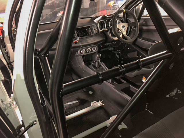 Mitsubishi Evo 10 roll cage interior being refitted