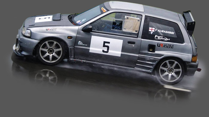 Daihatsu race car in the wet.